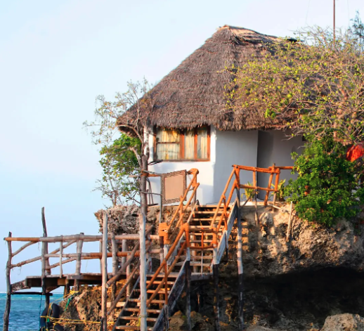 Traditional thatched restaurant on stilts over water